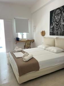 Postel nebo postele na pokoji v ubytování 23 Hotel Mykonos