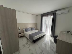 Voodi või voodid majutusasutuse Hotel Cocceio toas