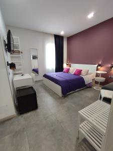 Postel nebo postele na pokoji v ubytování B&B CaselloA Suites