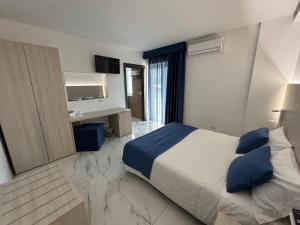 Voodi või voodid majutusasutuse Hotel Cocceio toas