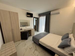 Voodi või voodid majutusasutuse Hotel Cocceio toas