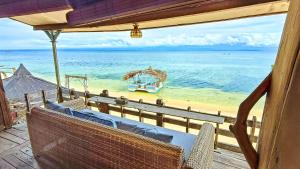 a view of the beach from a balcony of a resort at Fisherman Shack in Nusa Lembongan
