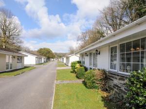 a row of white houses on a street at No 1 The Heathers in Saint Cleer