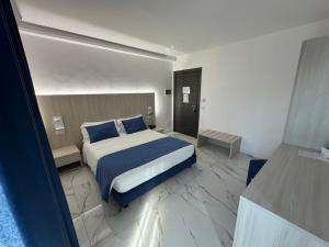 Voodi või voodid majutusasutuse Hotel Cocceio toas
