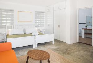 Postel nebo postele na pokoji v ubytování KITE BEACH HOTEL Oceanfront Apartments