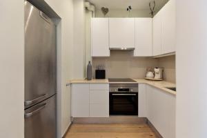 Kuchyňa alebo kuchynka v ubytovaní Enjoy Apartments Donna