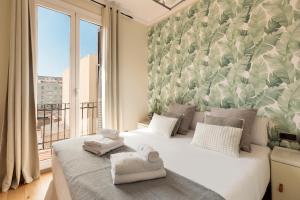 Posteľ alebo postele v izbe v ubytovaní Enjoy Apartments Donna