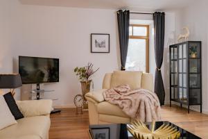 TV a/nebo společenská místnost v ubytování Apartment 2 Weide Zanthierhaus