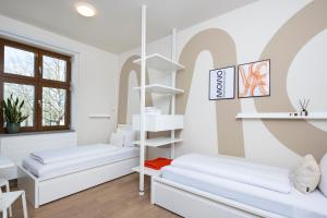 Postel nebo postele na pokoji v ubytování MOWO ConneKT - Monteurwohnungen in Kitzingen