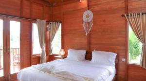 Postel nebo postele na pokoji v ubytování Nora Cottage