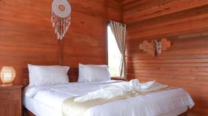 Postel nebo postele na pokoji v ubytování Nora Cottage