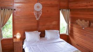 Postel nebo postele na pokoji v ubytování Nora Cottage