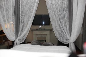 Postel nebo postele na pokoji v ubytování Aparthotel Dei Mercanti