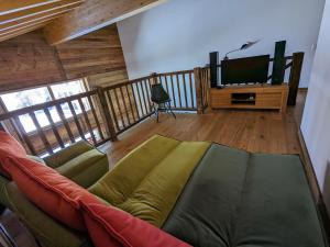 a living room with a couch and a television at Les Mayens MA 022 - LUXURY apart in Veysonnaz
