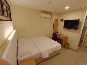 TV a/nebo společenská místnost v ubytování South of The Clouds HOTEL KL Sentral 吉隆坡彩云之南酒店-中央车站店
