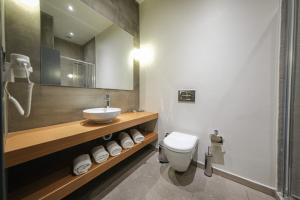 a bathroom with a white toilet and a sink at Nuru Ziya Residences in Istanbul +37 photos