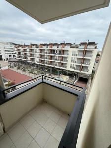a balcony with a view of a building at RESIDENCE MARINA MARCONI - Solo per famiglie in Lido di Jesolo