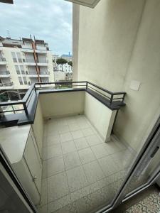 a balcony with a bench on top of a building at RESIDENCE MARINA MARCONI - Solo per famiglie in Lido di Jesolo +3 photos
