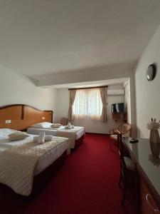 Postel nebo postele na pokoji v ubytování Hotel Bavaria Trogir