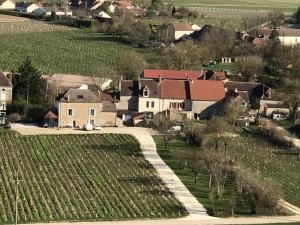an aerial view of a small village with a farm at Maison de Pauline, Chablis Vineyard in Préhy