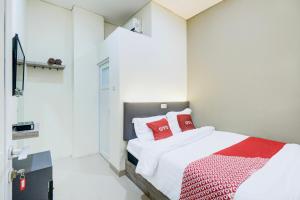 Postel nebo postele na pokoji v ubytování Krekot Residence Pasar Baru