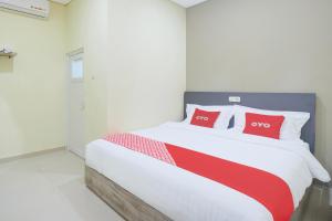 Postel nebo postele na pokoji v ubytování Krekot Residence Pasar Baru