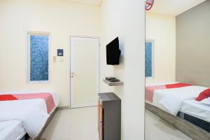 TV a/nebo společenská místnost v ubytování Krekot Residence Pasar Baru