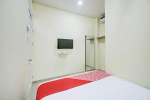 TV a/nebo společenská místnost v ubytování Krekot Residence Pasar Baru + 28 fotografií