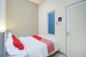 Postel nebo postele na pokoji v ubytování Krekot Residence Pasar Baru