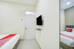 Postel nebo postele na pokoji v ubytování Krekot Residence Pasar Baru