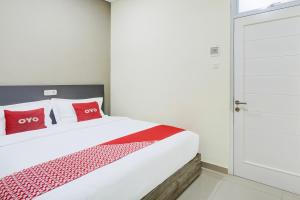 Postel nebo postele na pokoji v ubytování Krekot Residence Pasar Baru