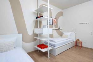 Postel nebo postele na pokoji v ubytování MOWO ConneKT - Monteurwohnungen in Kitzingen