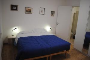 Ένα ή περισσότερα κρεβάτια σε δωμάτιο στο casadebacco24
