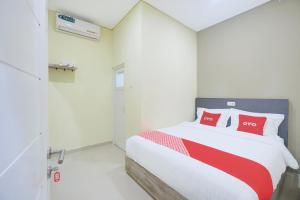 Postel nebo postele na pokoji v ubytování Krekot Residence Pasar Baru