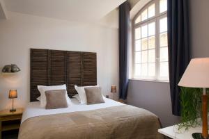 Postel nebo postele na pokoji v ubytování Hôtel Le Pré Galoffre