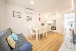 a living room with a couch and a table at GuestReady - Sunny Sesimbra Escape in Sesimbra
