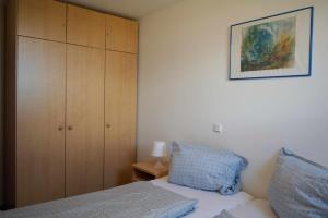 Ένα ή περισσότερα κρεβάτια σε δωμάτιο στο Inselblume 04 - Geräumige Ferienwohnung am Südstrand