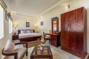 Postel nebo postele na pokoji v ubytování Mango Hill Coimbatore Destination Resort