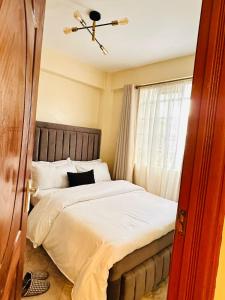 Postel nebo postele na pokoji v ubytování CM Homes