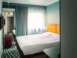 Postel nebo postele na pokoji v ubytování ibis Styles Brugge Centrum