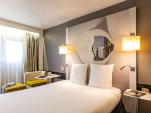 Postel nebo postele na pokoji v ubytování Mercure Metz Centre
