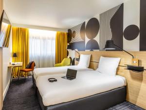 Postel nebo postele na pokoji v ubytování Mercure Metz Centre