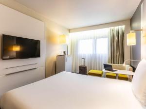 Postel nebo postele na pokoji v ubytování Mercure Metz Centre