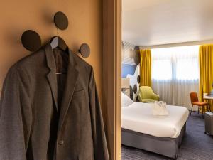 Postel nebo postele na pokoji v ubytování Mercure Metz Centre