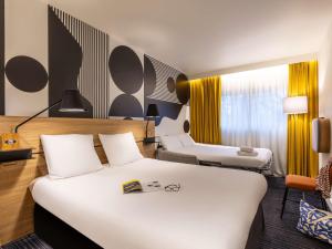 Postel nebo postele na pokoji v ubytování Mercure Metz Centre