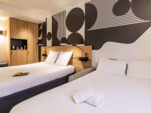 Postel nebo postele na pokoji v ubytování Mercure Metz Centre