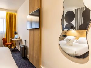 Postel nebo postele na pokoji v ubytování Mercure Metz Centre
