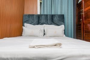 Voodi või voodid majutusasutuse T-Square Residence Makepe toas