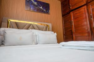 Voodi või voodid majutusasutuse T-Square Residence Makepe toas