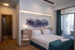 Voodi või voodid majutusasutuse Rooftop Hotel toas